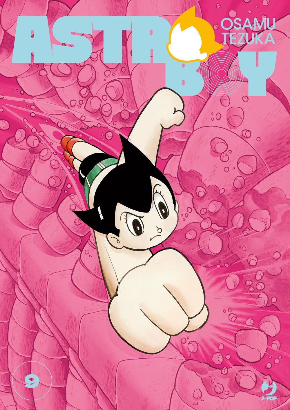 Copertina del manga Astro Boy Osamushi Collection Vol. 9 edito da J-POP. Un'illustrazione dinamica mostra Astro Boy, il celebre ragazzino robotico con i caratteristici capelli scuri a punta e stivaletti rossi, che vola a gran velocità verso l'osservatore con il pugno destro proteso in avanti. Lo sfondo è interamente sui toni del rosa acceso, caratterizzato da una complessa struttura che ricorda elementi organici e meccanici crivellati di buchi e crateri. In alto domina il grande titolo "ASTRO BOY" a grosse