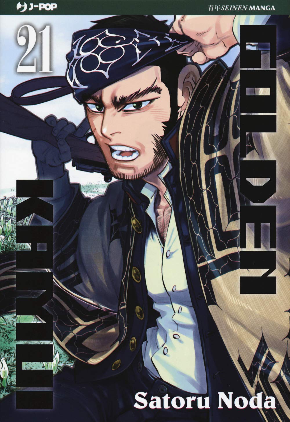 Copertina del manga Golden Kamui Vol. 21; il personaggio Tanigaki Genjiro, con barba e bandana nera con motivi Ainu, è ritratto in primo piano con espressione affannata mentre trasporta un carico sulla spalla.