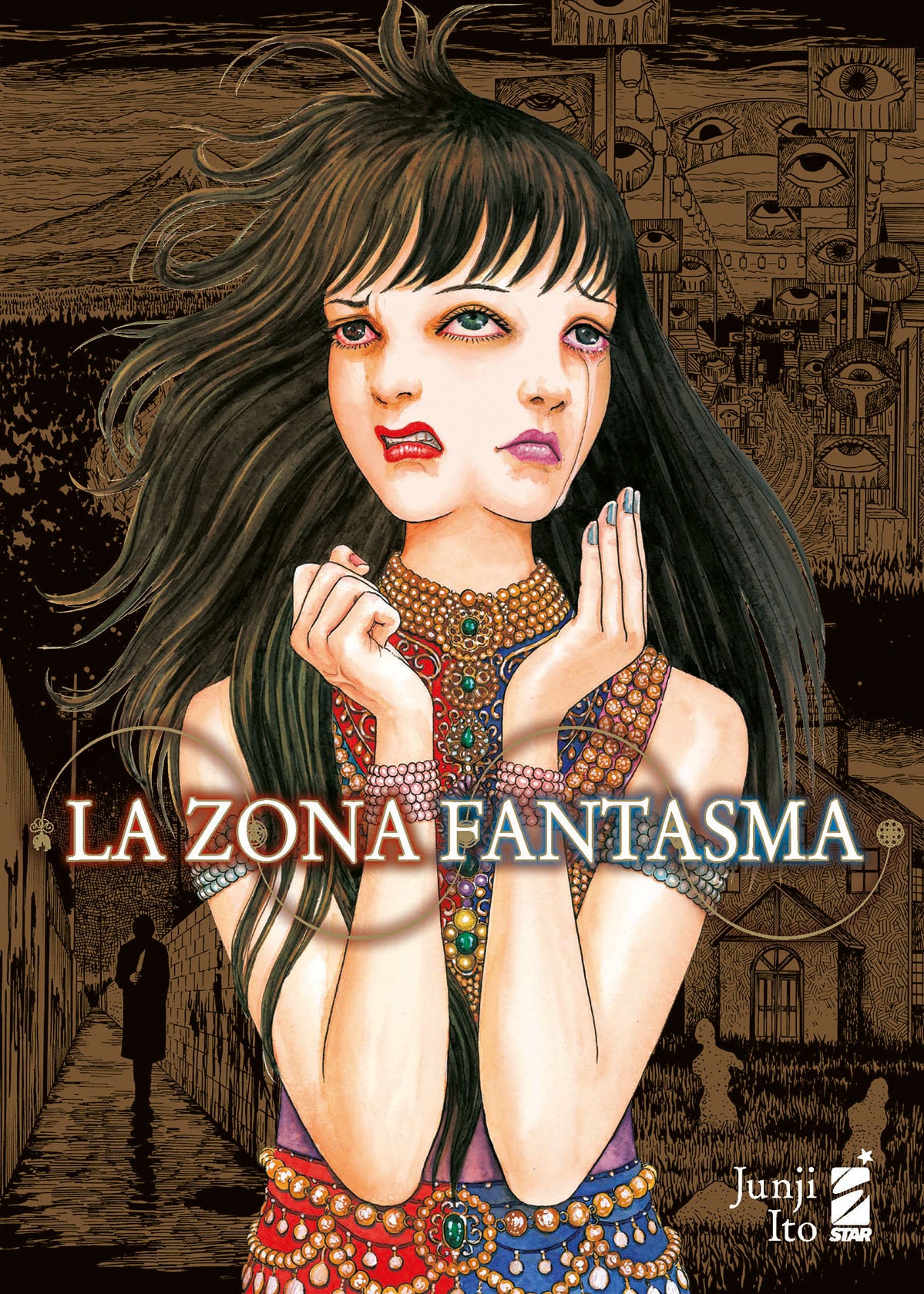 La copertina di La Zona Fantasma Vol. 1, illustrata da Junji Ito, mostra il volto pallido e inquietante di una donna con occhi vitrei e spalancati, che trasmette un senso di angoscia profonda.