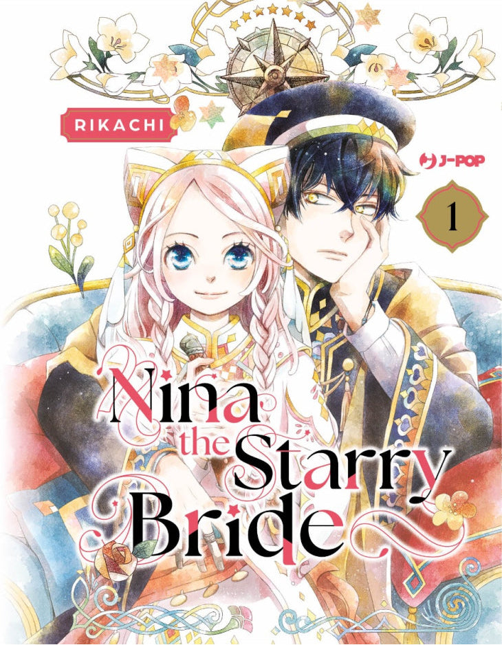 Copertina del manga Nina the Starry Bride Vol. 1 edito da J-POP Manga. L'illustrazione dai delicati toni acquerello mostra in primo piano due personaggi seduti su un divano azzurro con cuscini rossi. La ragazza ha lunghi capelli rosa chiaro mossi raccolti in trecce, grandi occhi azzurri brillanti e indossa un abito bianco decorato con motivi dorati e un cerchietto con orecchie da gatto stilizzate. Dietro di lei, un ragazzo con capelli neri e intensi occhi gialli indossa una divisa militare scura con ricami