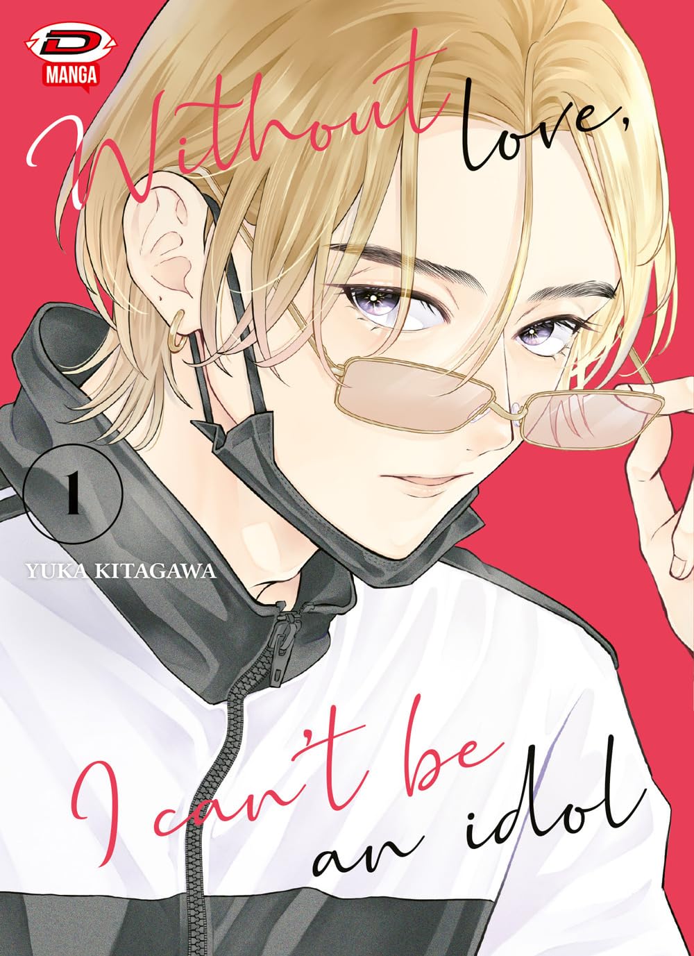Copertina del primo volume del manga Without Love, I Can't Be An Idol. L'illustrazione in primo piano mostra il protagonista Ibuki, un ragazzo biondo che guarda in avanti mentre abbassa leggermente un paio di occhiali da vista sottili. Indossa una felpa sportiva bianca e nera e ha una mascherina nera protettiva abbassata sotto il mento. Lo sfondo è rosso acceso con il titolo scritto in un elegante corsivo, mentre a sinistra compaiono il numero 1, il nome dell'autrice Yuka Kitagawa e il logo Dynit Manga in a