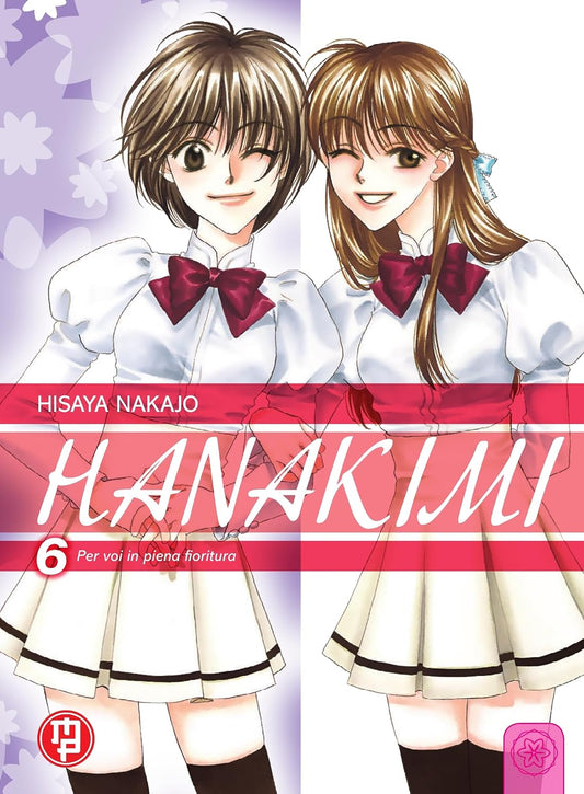 Copertina del sesto volume in italiano del manga 'Hanakimi - Per voi in piena fioritura' di Hisaya Nakajo, edito da Magic Press. L'illustrazione mostra in primo piano la protagonista Mizuki Ashiya (a sinistra) con capelli corti castani mentre ammicca sorridente, affiancata sulla destra da una ragazza dai lunghi capelli castani, entrambe vestite con un abito bianco femminile decorato con un grande fiocco rosso sul colletto.