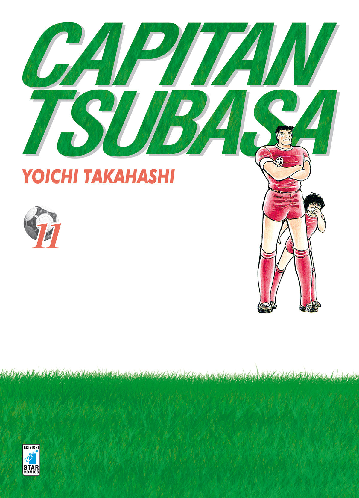 Copertina dell'undicesimo volume del manga 'Capitan Tsubasa New Edition' di Yoichi Takahashi, edito da Star Comics. L'illustrazione su sfondo bianco con prato verde in basso mostra il grande titolo verde 'CAPITAN TSUBASA', il nome dell'autore Yoichi Takahashi e le figure di Roberto Hongo a braccia incrociate in divisa rossa insieme a Tsubasa Ozora da piccolo, affiancati dall'icona del pallone da calcio con il numero 11.