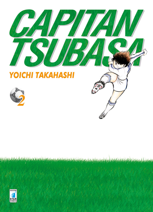 Copertina del manga Capitan Tsubasa New Edition 2. Sfondo prevalentemente bianco con un prato verde nella parte inferiore, mentre Tsubasa in divisa bianca e blu è sospeso in aria ed esegue una spettacolare rovesciata.