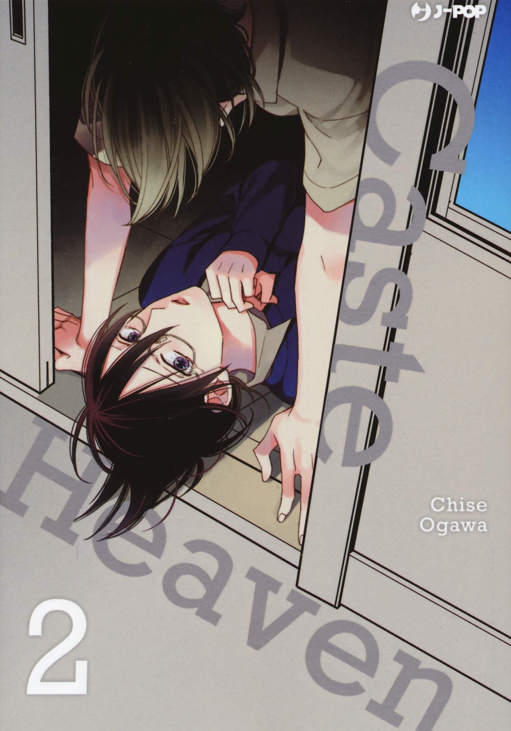 Copertina del manga Caste Heaven volume 2. Illustrazione con vista dall'alto di due giovani in una posa intima e tesa. Un ragazzo dai capelli scuri è sdraiato a terra, con le mani vicine al viso e lo sguardo rivolto in alto, mentre un altro ragazzo si china su di lui bloccandolo con le braccia, mantenendo il viso nascosto dall'inquadratura. Il titolo in grigio semitrasparente si sovrappone ai personaggi.