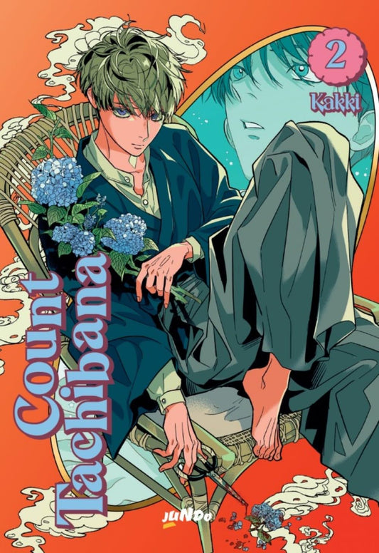 Copertina del secondo volume in italiano dell'opera 'Count Tachibana' di Kakki, edita da Jundo. L'illustrazione su sfondo arancione vivace mostra un giovane dai capelli verdi seduto su una poltrona in vimini con un mazzo di ortensie blu in mano, mentre alle sue spalle uno specchio incorniciato ne riflette il volto in sfumature azzurre e verde acqua.