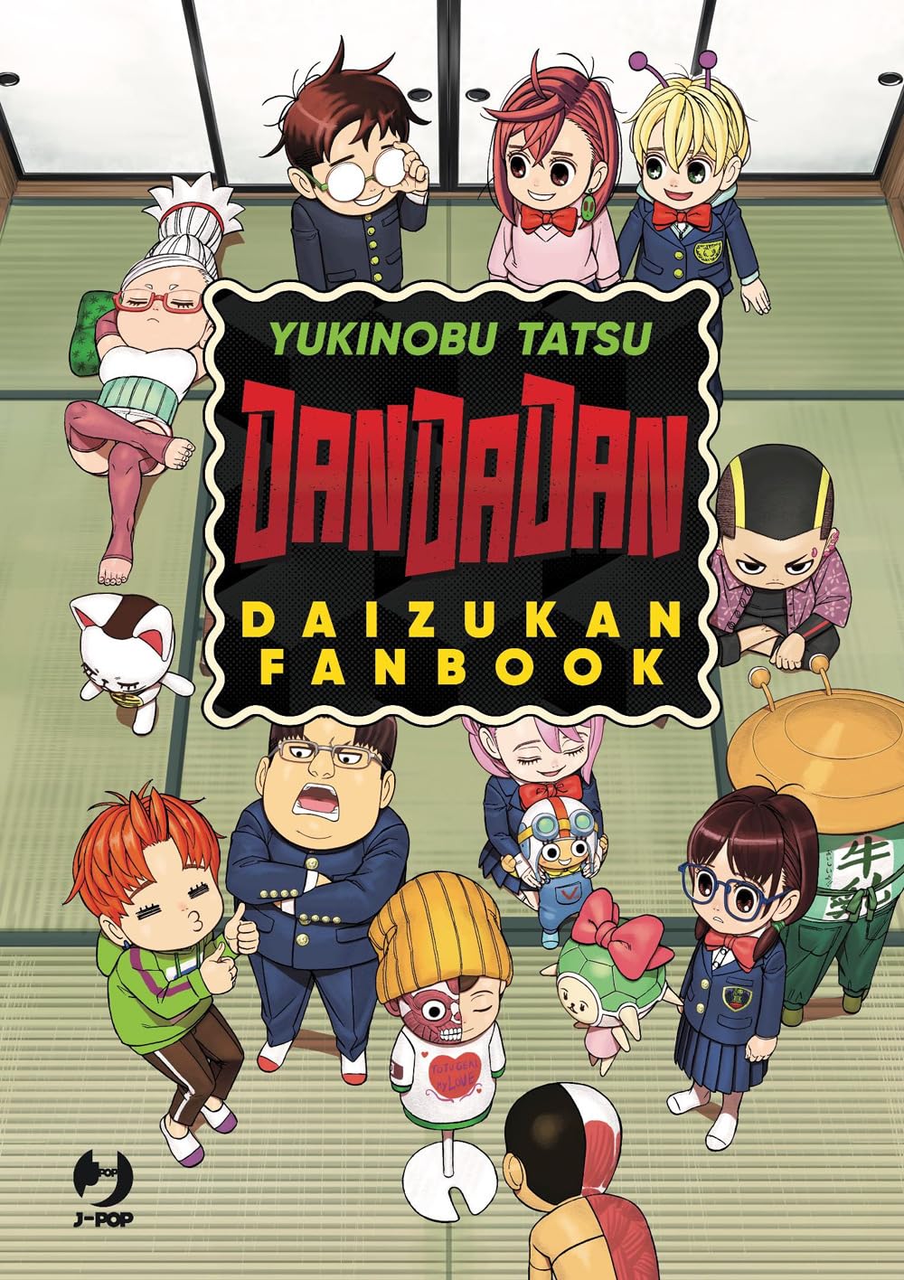 La copertina del Dandadan Official Fanbook, che presenta un'illustrazione corale vivace e colorata con i protagonisti Momo Ayase e Okarun circondati dai vari alieni e spettri della serie.