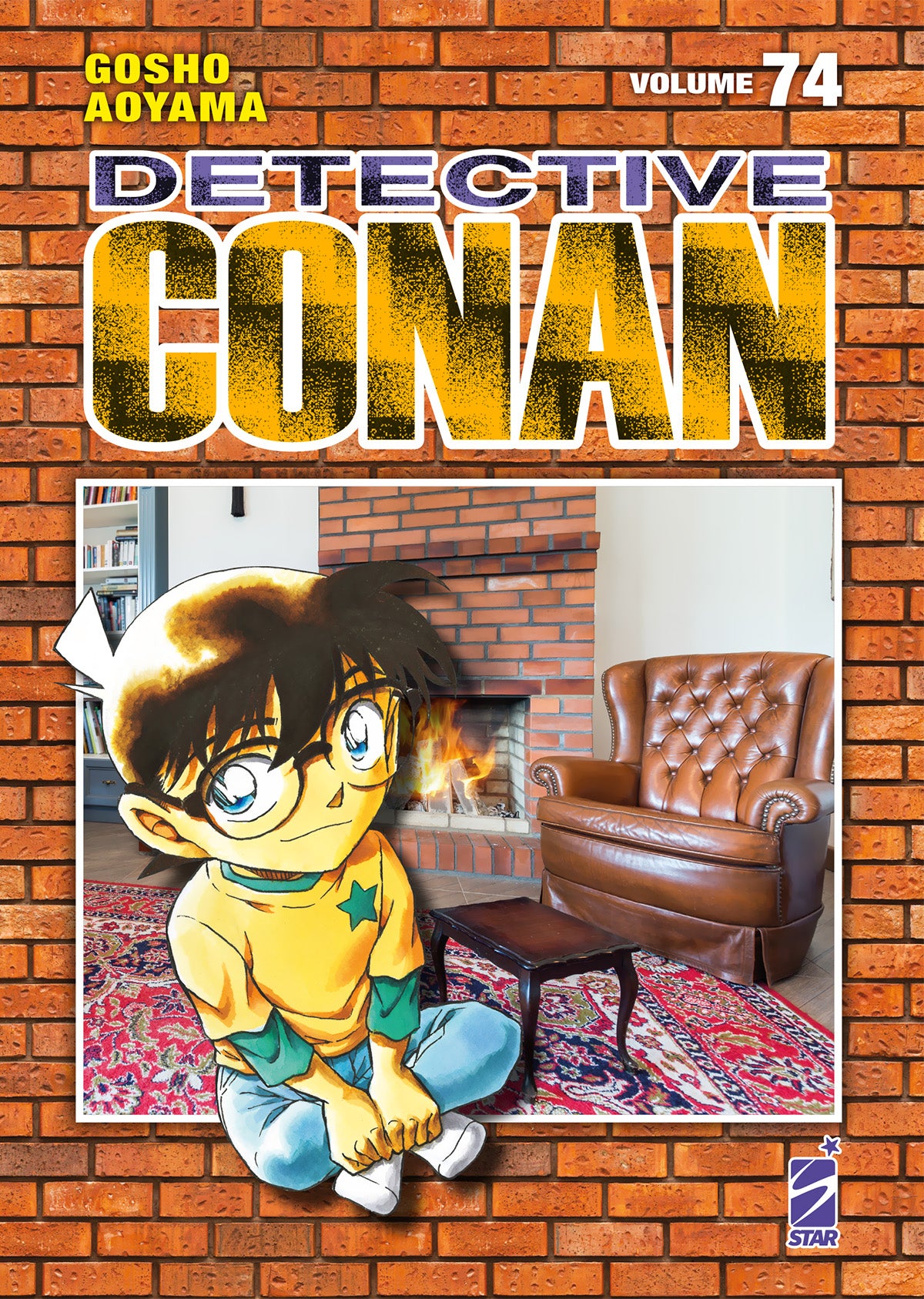 Copertina di Detective Conan New Edition Vol. 74 di Gosho Aoyama edito da Star Comics con Conan seduto sul pavimento davanti a un camino e a una poltrona.   