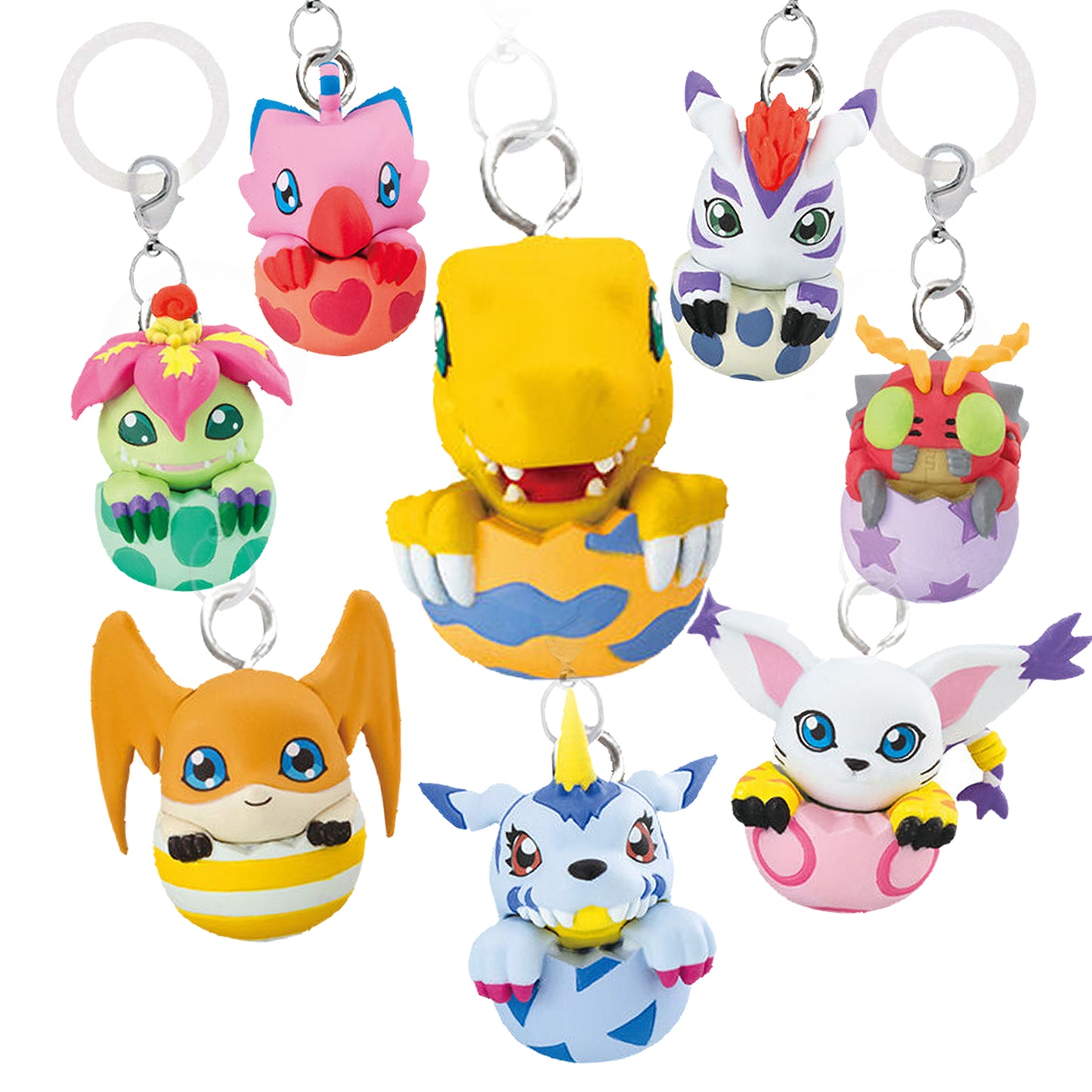 Immagine promozionale di 8 ciondoli gashapon della serie Digimon disposti su uno sfondo bianco pulito. Tutti i personaggi sono raffigurati a mezzo busto, intenti a uscire dai loro tipici gusci di Digi-Uovo. Al centro domina Agumon, che spunta dal suo uovo arancione decorato con strisce blu ondulate. Attorno a lui, partendo dall'alto a sinistra in senso orario, troviamo: Biyomon in un uovo rosa con cuori rossi, Gomamon in un uovo bianco con macchie azzurre, Tentomon in un uovo viola decorato con stelle.
