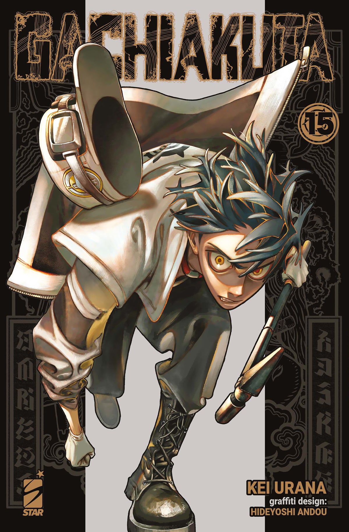 Copertina del manga Gachiakuta numero 15. Il protagonista Rudo è ritratto in una posa acrobatica e dinamica, con occhi gialli luminosi e uno stile grafico graffiti.