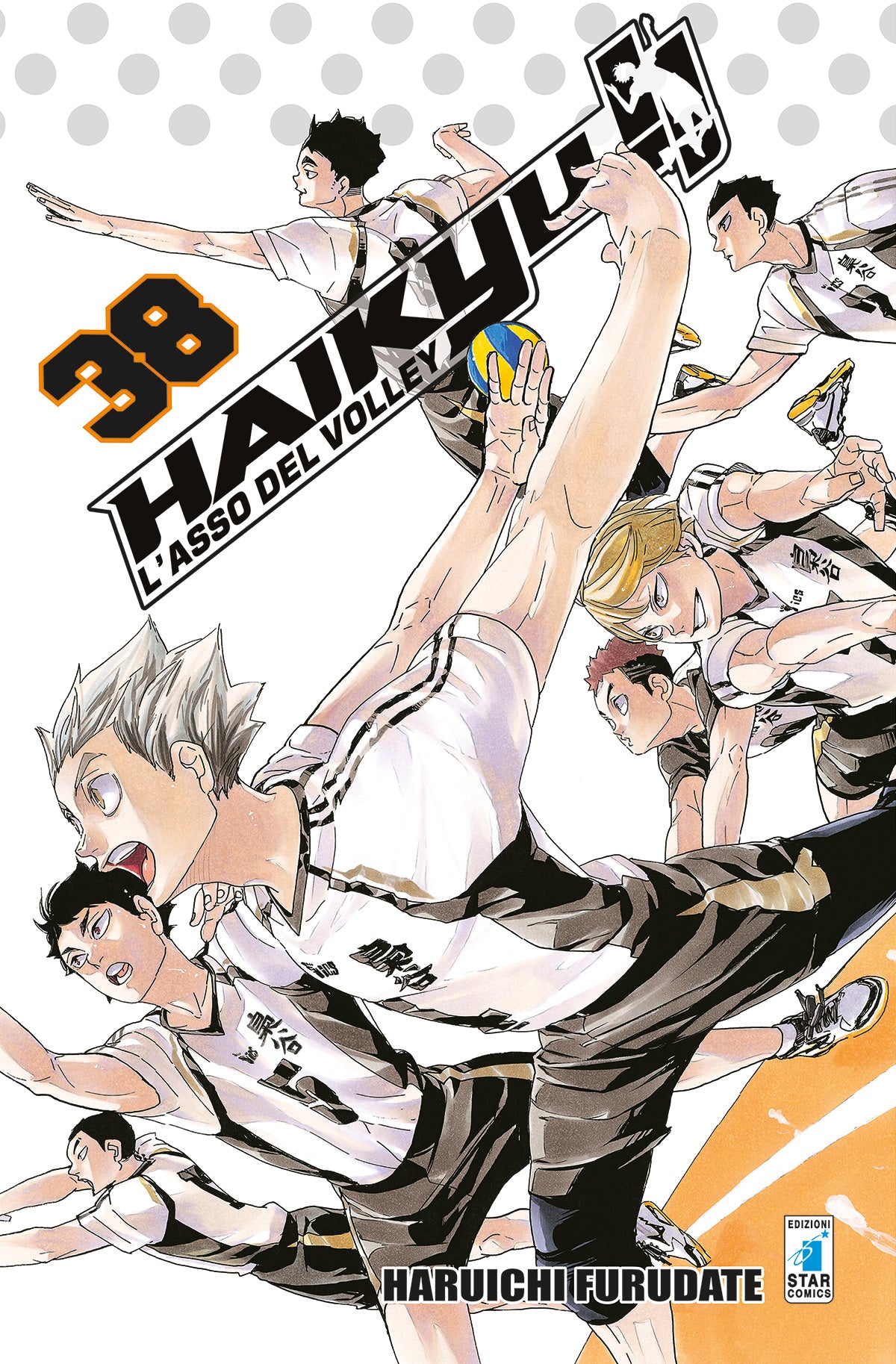 Copertina del manga Haikyu!! Vol. 38. Illustrazione dinamica e corale della squadra del Fukurodani in azione sul campo di pallavolo: in primo piano Bokuto si lancia in una potente schiacciata, circondato da Akaashi e dagli altri compagni di squadra in divisa bianca, nera e oro.