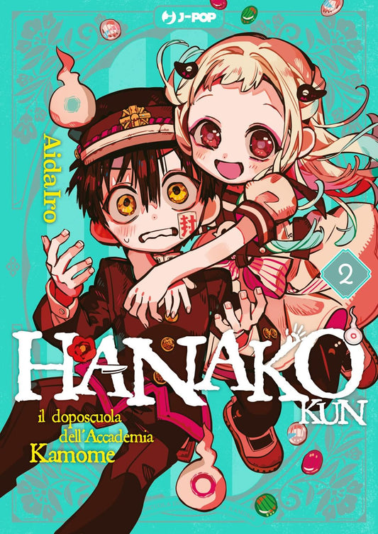 Copertina del manga Hanako-kun il doposcuola dell'Accademia Kamome volume 2. La ragazza bionda Nene Yashiro abbraccia da dietro e tira giocosamente la guancia di Hanako, che sfoggia un'espressione decisamente sorpresa e imbarazzata. Attorno a loro fluttuano piccoli spiriti e caramelle su un vivace sfondo azzurro decorato con motivi floreali.
