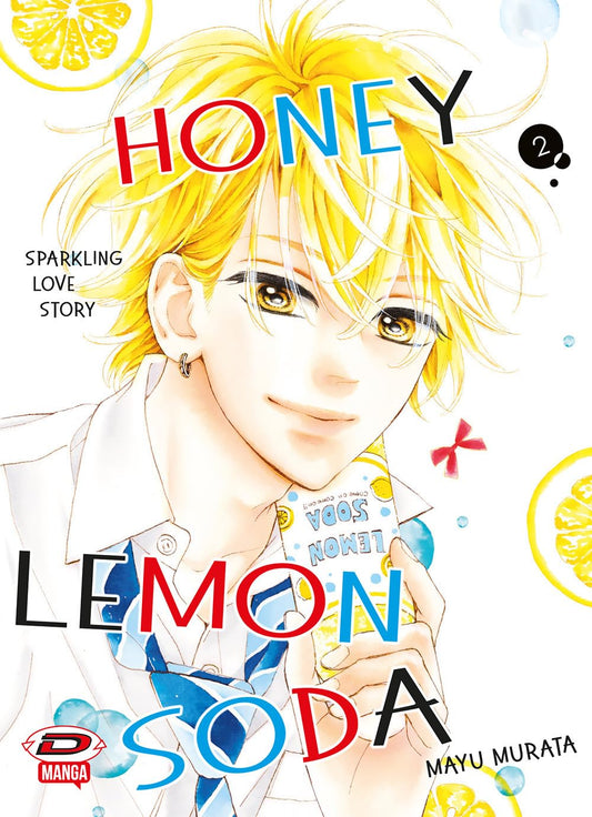 Copertina di Honey Lemon Soda 2. Primo piano di un ragazzo sorridente con capelli biondi luminosi e una confezione di succo in mano, su sfondo bianco con fette di limone.