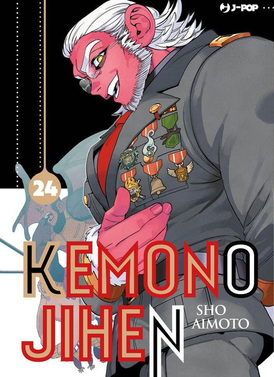 Copertina del ventiquattresimo volume in italiano del manga 'Kemono Jihen' di Sho Aimoto, edito da J-POP Manga. L'illustrazione mostra in primo piano di profilo un imponente personaggio dalla pelle rossa con capelli e barba corti bianchi, vestito con una giacca militare grigia decorata da numerose medaglie e un monocolo da vista, mentre sorride con espressione sicura.