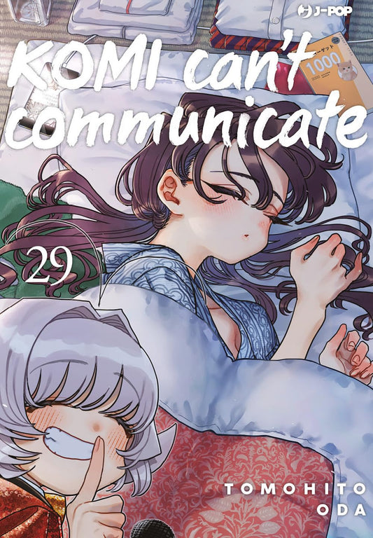 Copertina del ventinovesimo volume del manga 'Komi Can't Communicate' di Tomohito Oda, edito da J-POP Manga. L'illustrazione ritrae Shouko Komi addormentata serenamente sotto le coperte in yukata, con in basso a sinistra un dettaglio di Najimi Osana che sorride maliziosamente facendo il segno del silenzio con il dito sulle labbra, sormontate dal titolo in bianco e dal numero 29 a sinistra.