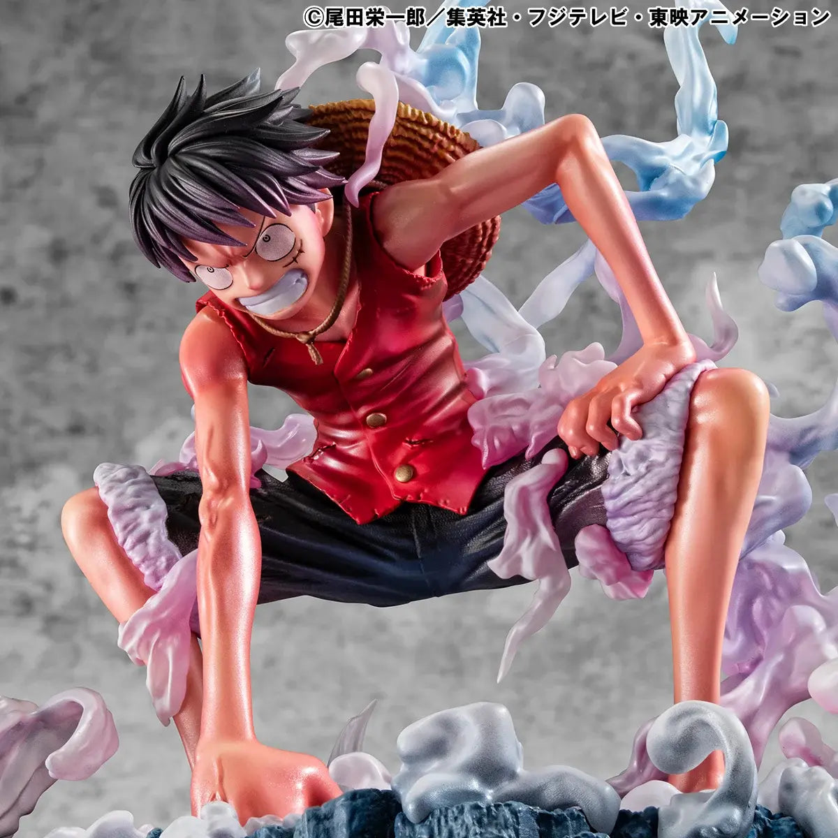 Figura da collezione di Monkey D. Luffy in modalità Gear Second tratta da One Piece, visibile nel file luffy.jpg. Il protagonista è accovacciato nella sua iconica posa da combattimento con un pugno a terra, la pelle arrossata dallo sforzo e grandi volute di fumo sfumate tra il rosa e l'azzurro che lo circondano.