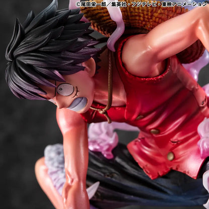 Figura da collezione di Monkey D. Luffy in modalità Gear Second tratta da One Piece, visibile nel file luffy.jpg. Il protagonista è accovacciato nella sua iconica posa da combattimento con un pugno a terra, la pelle arrossata dallo sforzo e grandi volute di fumo sfumate tra il rosa e l'azzurro che lo circondano.
