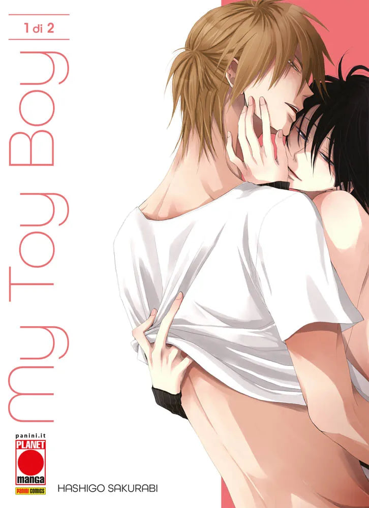 Copertina del primo volume del manga Boys' Love 'My Toy Boy' di Hashigo Sakurabi, edito da Panini Planet Manga. L'illustrazione ritrae un abbraccio passionale tra un ragazzo dai capelli biondi in maglietta bianca e un ragazzo dai capelli neri, affiancati dal titolo in verticale, dal logo Planet Manga e dalla dicitura '1 di 2'.