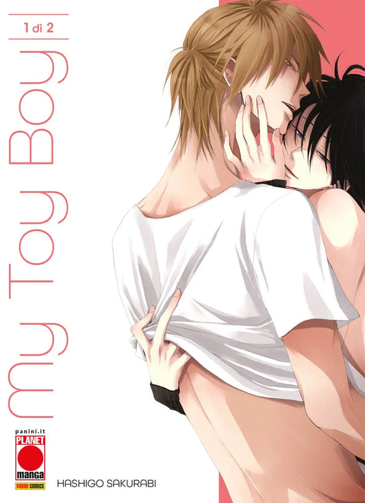 Copertina del primo volume del manga Boys' Love 'My Toy Boy' di Hashigo Sakurabi, edito da Panini Planet Manga. L'illustrazione ritrae un abbraccio passionale tra un ragazzo dai capelli biondi in maglietta bianca e un ragazzo dai capelli neri, affiancati dal titolo in verticale, dal logo Planet Manga e dalla dicitura '1 di 2'.