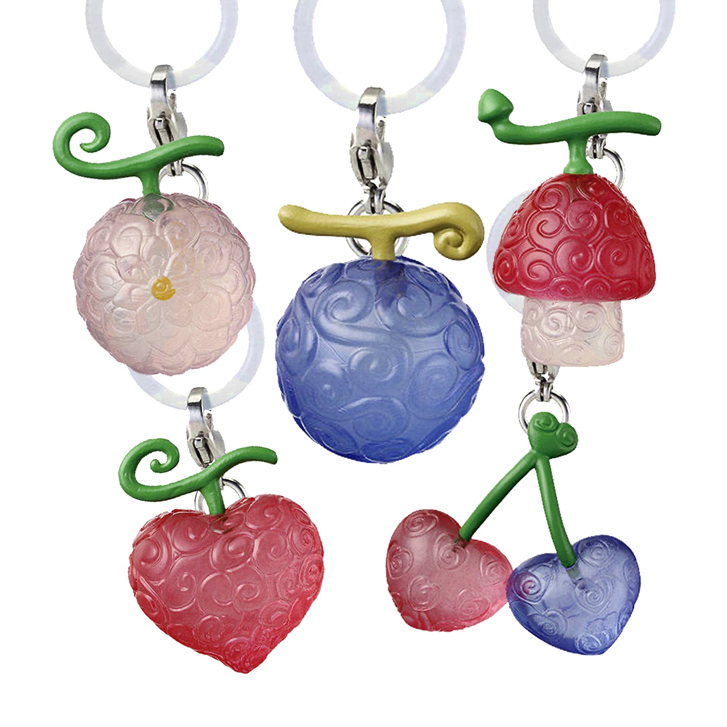 Un set di 5 ciondoli colorati e traslucidi che raffigurano i Frutti del Diavolo di One Piece (viola, rosso, rosa), appesi a degli anelli di silicone trasparente, pronti per essere usati come marker.