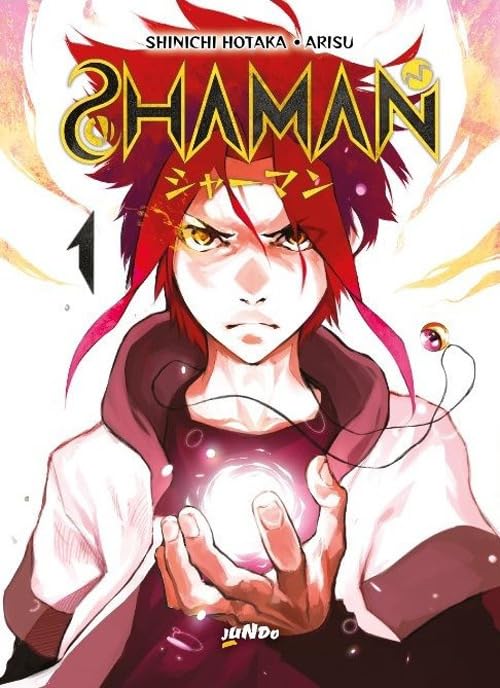 Copertina del manga Shaman volume 1. Un ragazzo dai capelli rossi fissa lo spettatore mentre sprigiona una sfera di energia luminosa tra le mani.