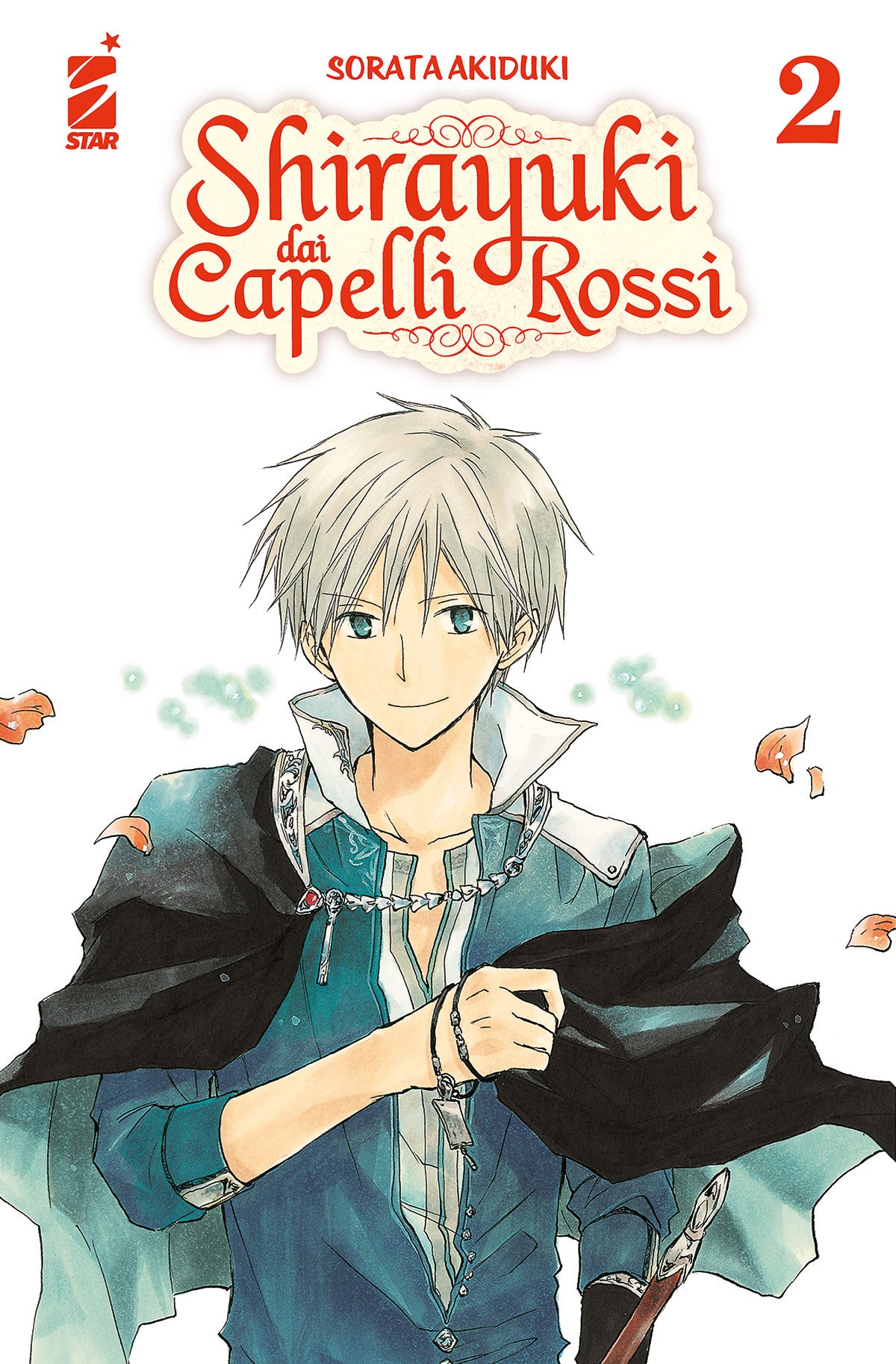 Copertina del secondo volume in italiano del manga shojo fantasy 'Shirayuki dai Capelli Rossi' di Sorata Akiduki, edito da Star Comics. L'illustrazione su uno sfondo bianco arricchito da petali di fiori in volo ritrae in primo piano a mezzo busto il principe Zen Wistaria con corti capelli d'argento, occhi azzurri e un lieve sorriso, vestito con tunica azzurro-blu, mantello nero sulle spalle e catena d'argento con ciondolo al collo, sormontato dal titolo SHIRAYUKI DAI CAPELLI ROSSI in rosso, dal numero 2 in 