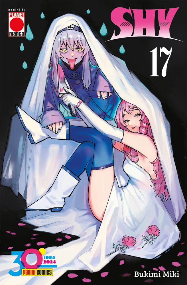 Copertina del diciassettesimo volume in italiano del manga 'Shy' di Bukimi Miki, edito da Panini Planet Manga. L'illustrazione su sfondo nero con gocce azzurre ritrae due personaggi sotto un velo bianco: in alto una figura con cappello scuro, capelli viola e lingua di fuori che impugna un coltello insanguinato, in basso una ragazza sorridente in abito bianco con rose rosa e capelli rosa, sormontati dal titolo SHY in rosa fucsia, dal numero 17 e dal logo promozionale dei 30 anni di Panini Comics in basso a s