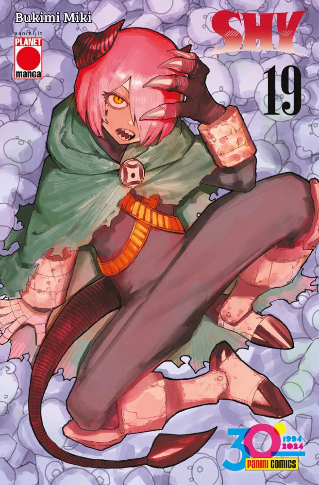 Copertina del diciannovesimo volume in italiano del manga 'Shy' di Bukimi Miki, edito da Panini Planet Manga. L'illustrazione su uno sfondo composto da orsetti di peluche sfumati ritrae un personaggio in veste demoniaca con corti capelli rosa, corna scure, occhio giallo, zanne affilate, mantello verde strappato, coda ricurva e costume scuro in posa raggomitolata, sormontato dal titolo SHY in rosso fucsia in alto a destra, dal numero 19 in nero e dal logo promozionale dei 30 anni di Panini Comics in basso a 