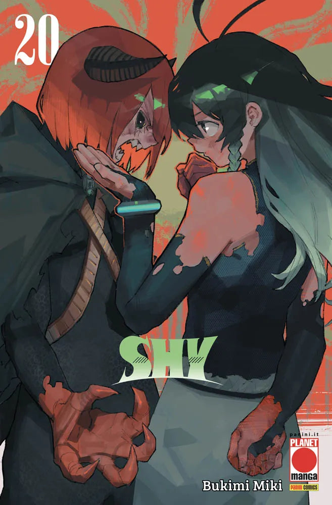 Copertina del ventesimo volume in italiano del manga 'Shy' di Bukimi Miki, edito da Panini Planet Manga. L'illustrazione su uno sfondo artistico rosso e arancione ritrae due personaggi l'uno di fronte all'altro in un teso confronto: a sinistra una figura demoniaca con mantello scuro, corno, denti affilati e mano ad artiglio rossa; a destra una ragazza dai lunghi capelli verde scuro con treccia che la fissa con intensità, sormontati dal numero 20 in alto a sinistra, dal titolo SHY in verde chiaro in basso e 