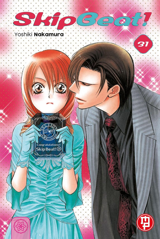Copertina del volume 31 di Skip Beat! edito da Magic Press con Kyoko in abito azzurro e Ren che le si avvicina al volto.