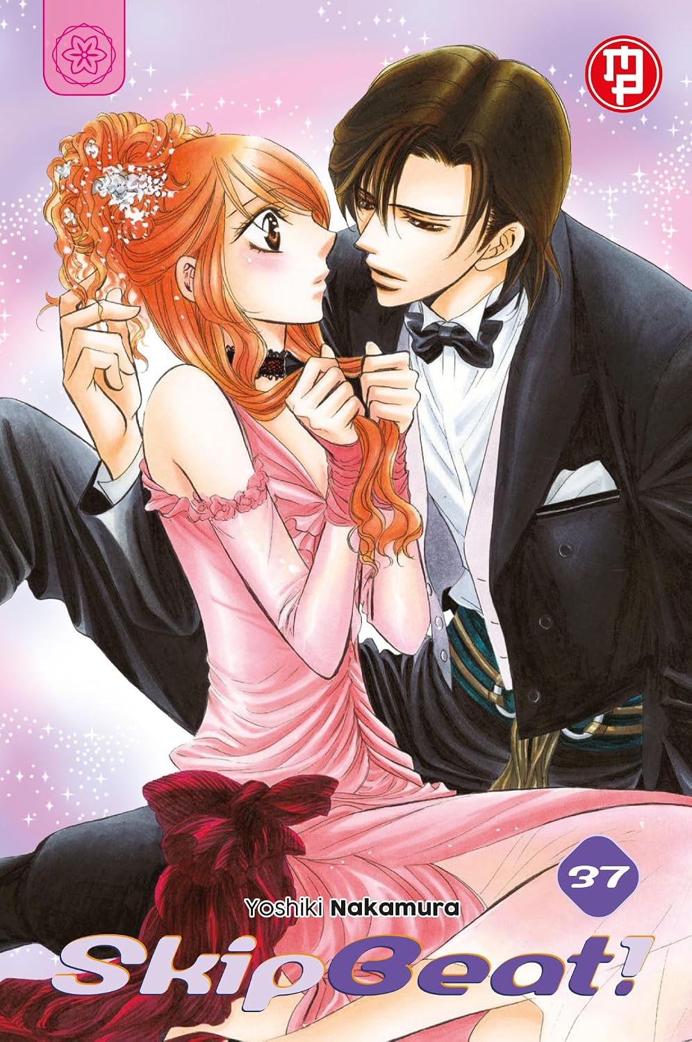 Copertina del trentasettesimo volume del manga 'Skip Beat!' di Yoshiki Nakamura, edito da Magic Press. L'illustrazione ritrae Ren Tsuruga in tuxedo vicino a Kyoko in abito da sera rosa, con il numero 37 in basso.