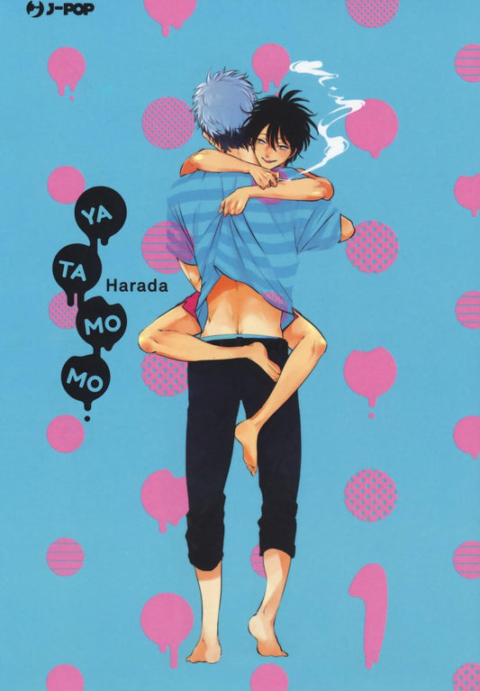 Copertina del manga Yatamomo volume 1. Su un vivace sfondo azzurro decorato con pois e macchie rosa, due giovani ragazzi a piedi nudi sono stretti in un intimo abbraccio. Il ragazzo di spalle, che indossa una maglia a righe blu e pantaloni scuri, sostiene l'altro, che gli avvolge le gambe intorno alla vita sorridendo furbescamente con una sigaretta in bocca. Una serie di baloon neri a sinistra riporta il titolo "YA TA MO MO" sillabato e il nome dell'autrice "Harada".