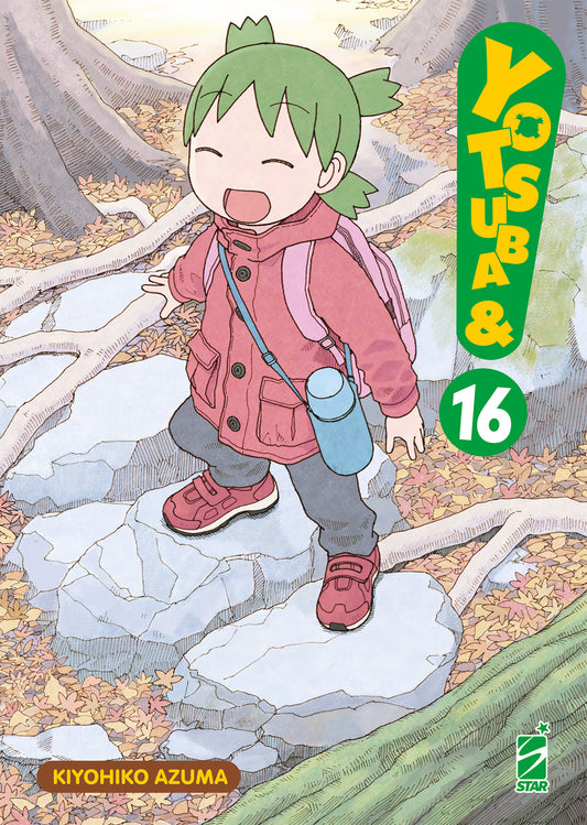 Copertina del manga Yotsuba&! volume 16. Un'illustrazione dal tratto delicato che mostra Yotsuba, con i suoi inconfondibili codini verdi, sorridente e felice mentre cammina su dei massi in un bosco autunnale coperto di foglie, indossando una giacca rosa e una borraccia azzurra a tracolla.